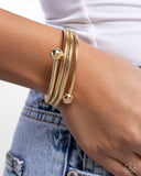 calmly-coiled-gold
